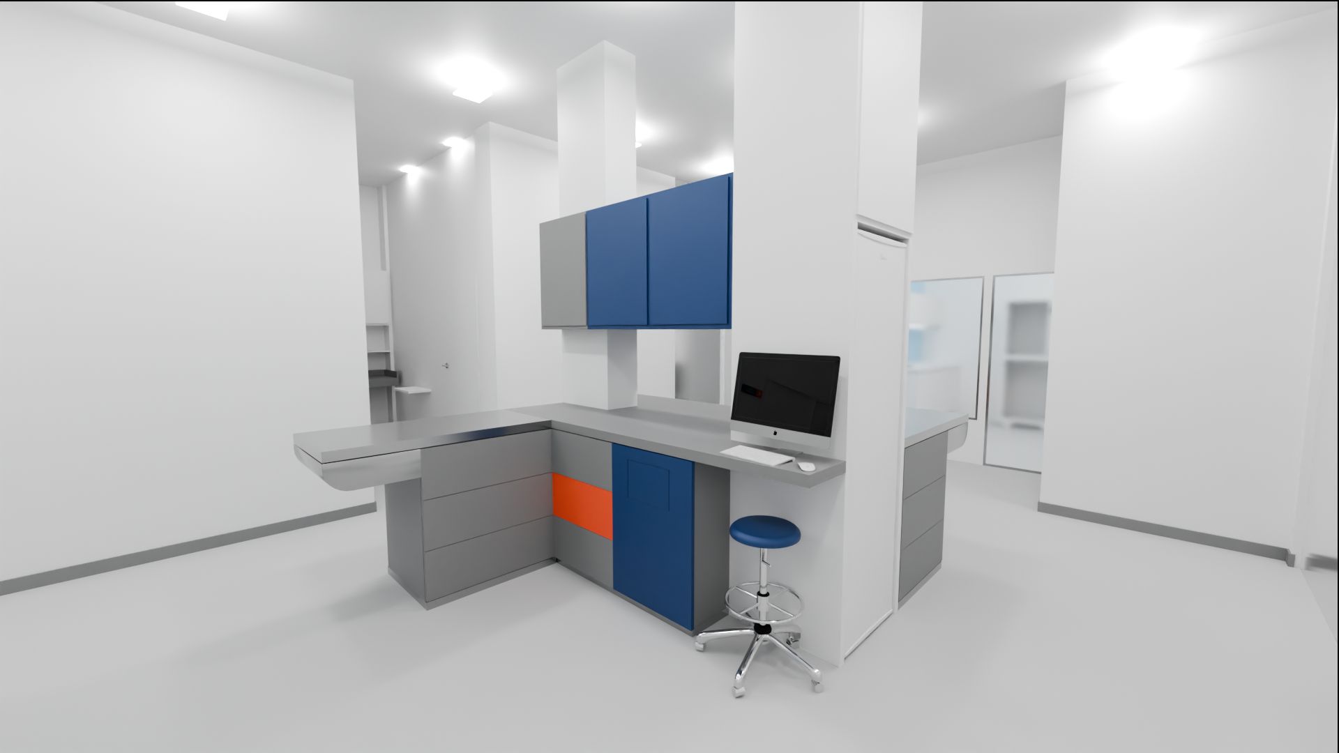 Zona de tratamento da clínica, com bancada e mesa de tratamentos em inox, armários azuis e cinza e computador.