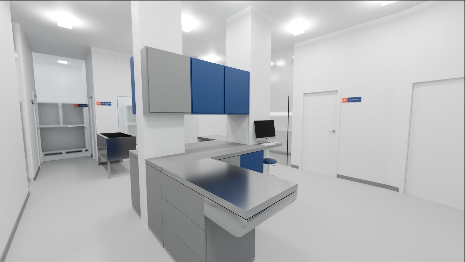 Zona de tratamentos da clínica, com mesa de tratamentos em inox, armários azuis suspensos e sinalética das áreas internas.
