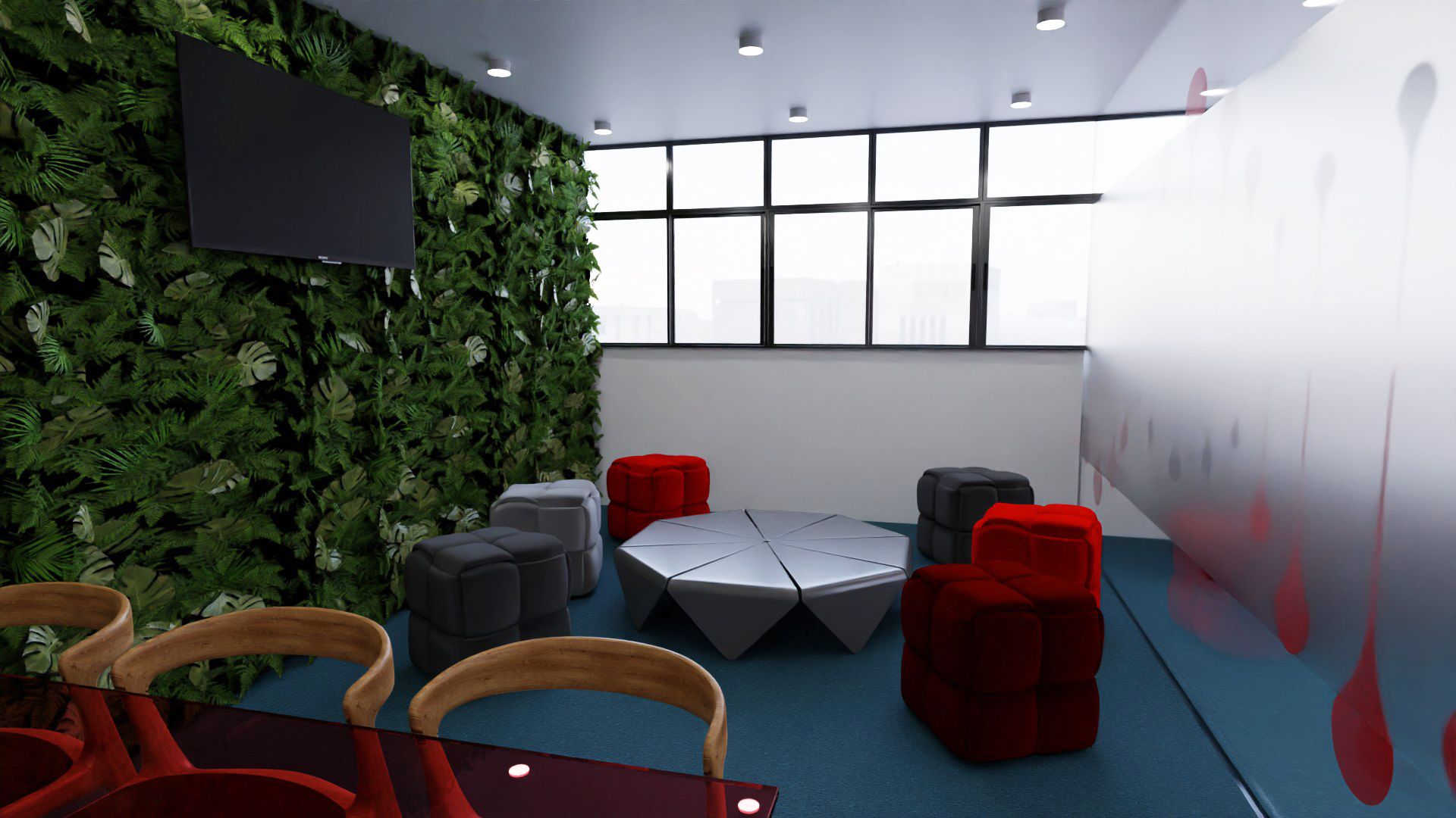 Sala de convívio com jardim vertical, televisão, pufes vermelhos, cinzentos escuros e claro, mesa central octogonal, mesa de vidro vermelho com cadeiras de madeira e uma parede com o grafismo de gotas.